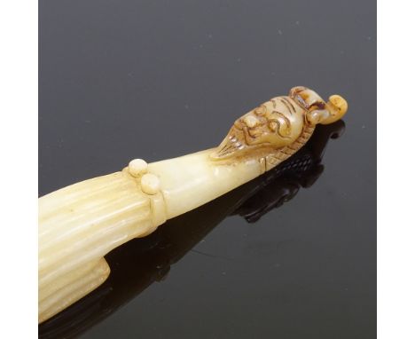 A Chinese relief carved jade dragon design belt hook, length 12.5cm 