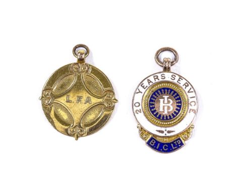 2 9ct gold presentation medals, including 20 Years' Service BIC Ltd enamelled example, largest height 29.5mm, 12.4g total (2)
