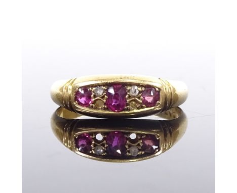 An early 20th century 18ct gold 7-stone ruby and diamond half hoop ring, maker's marks AEC, hallmarks Birmingham 1900, settin