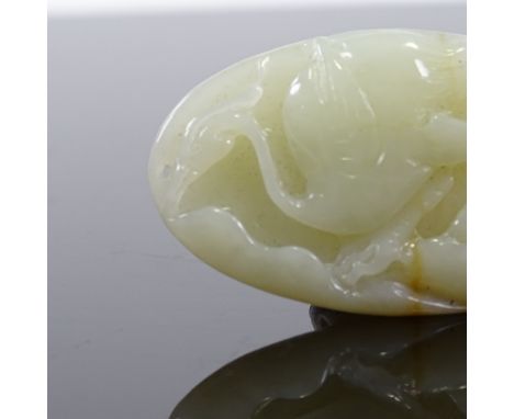 A Chinese relief carved celadon jade crane design pendant, length 5.5cm 