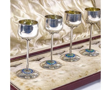 A set of 6 Edwardian Art Nouveau silver and enamel liqueur goblets, gilt bowl interior supported by tri-form wire stem with p