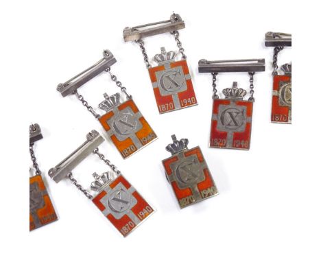 GEORG JENSEN - a set of Danish sterling silver and red enamel Kingmark jewellery, comprising 6 brooches and 1 badge, badge he
