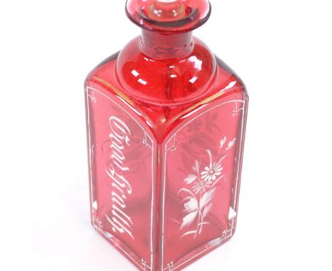 A Victorian cranberry glass square-section spirit decanter, with hand painted milk glass decoration, inscribed Good Health, o