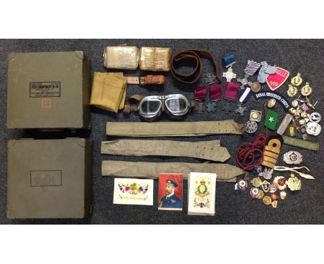 A collection of mixed militaria to include reproduction medals, post war Allied and Soviet insignia, WW2 British Shell dressi