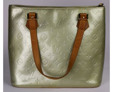 A Louis Vuitton Monogram Mint Green patent leather handbag with polished brass hardware features two top handles and a zipper
