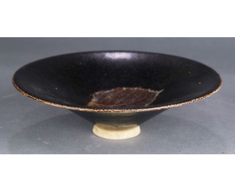 A Chinese Jizhou 'leaf' tea bowl, of conical form with thinly potted wide flaring sides, the interior decorated with the impr