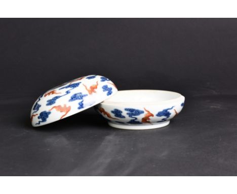 A Chinese Blue and white and iron red porcelain lidded Box, of rounded form, painted with bats and scroll. H10 x D16.5 cm