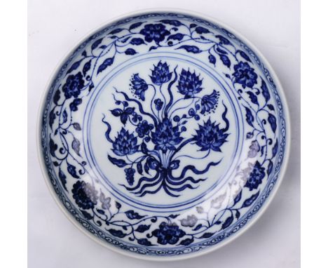 A Chinese blue and white "lotus scroll" dish, with double-ring mark to the base, 7.5"dia