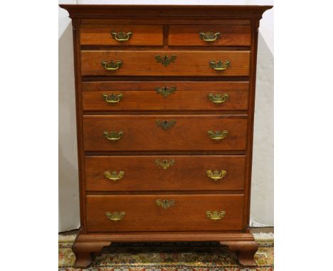 Pennsylvania Chippendale tall chest circa 1780, the seven drawer case with fluted quarter pilasters, and rising on ogee brack
