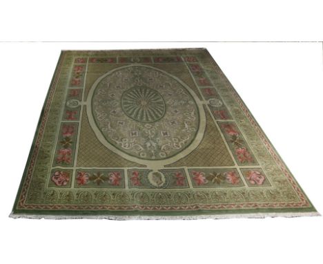A large custom hand made Tibetan area carpet, the large form in the style of a French Aubusson, having an acanthus decorated 