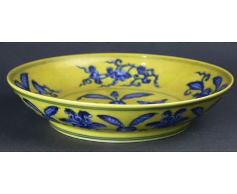 Chinese Underglaze Blue and Yellow Enameled Dish, of shallow rounded sides, the interior painted in shades of cobalt blue wit