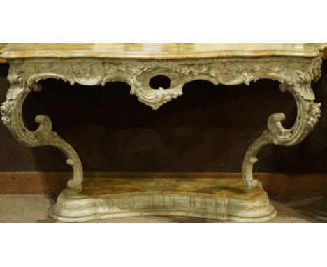A French Console d Applique 18th century, with later elements, having a faux marble paint decorated serpentine top above the 
