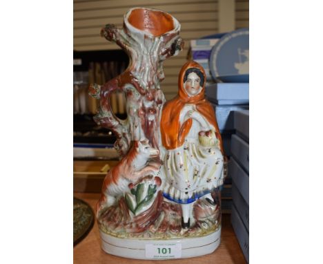 A ceramic Staffordshire figure base or spill vase depicting Little red riding hood and wolf
Condition Report several cracks t