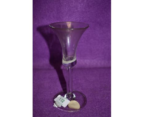 A wine glass having trumpet bowl with opaque enamel (possibly a twist gone wrong?) with elongated tear drop over domed and fo