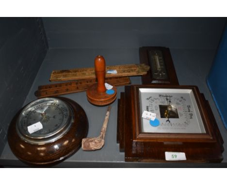 An assortment of items including Barometers, wooden darning mushroom, clay pipe and two foldable wooden rules.