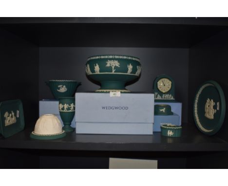 A selection of Jasperware ceramics by Wedgwood in an unusual Jade green ground, including fruit bowl and clock most pieces bo