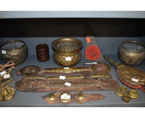 A variety of brass including plant pots of Indian design, door knocker, bells, weights and similar, also included is a set of