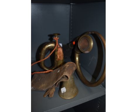 A Swiss style cow bell a small bugle and motor or cycle horn