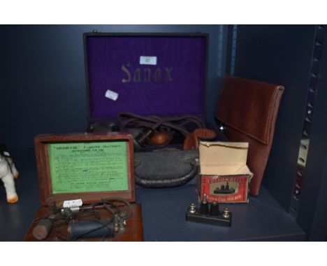 A selection of early medical quackery instruments including Sanax electrical tool