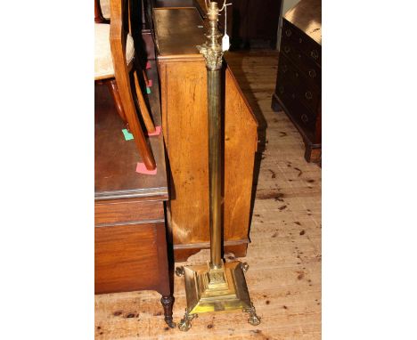 Brass corinthian column standard lamp on four paw feet