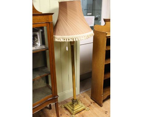 Brass corinthian column standard lamp and shade on four paw feet