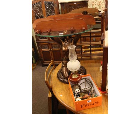 Figural glass topped coffee table, gilt framed plaque, two wall shelves, lamp and condiments