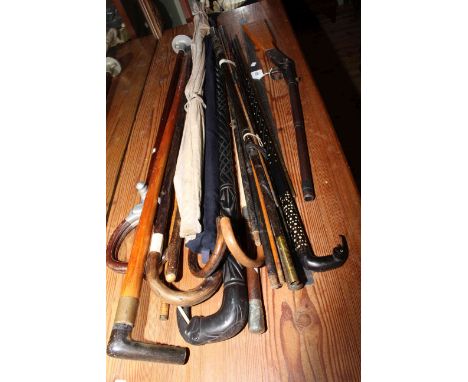 Collection of walking sticks, shooting stick, fishing rod, air rifle, two Firkin barrel measures, etc