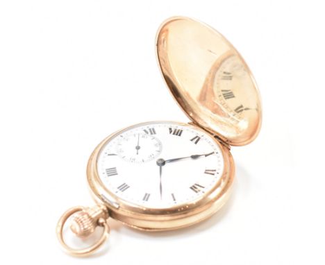 A hallmarked&nbsp; 9ct gold full hunter pocket watch. The pocket watch having a enamel face with roman numeral chapter ring w