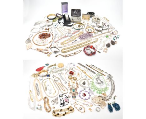 A large collection of assorted costume jewellery, the lot to include; rings, earrings. necklaces, chains, pendant, bangles, b