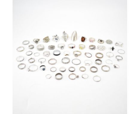 A large collection of white metal rings. The lot to include; white stones, solitaire rings, ring fragments, cluster ring, cro