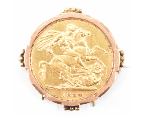 A 19th Century Victorian 1884 full 22ct gold sovereign coin / full sovereign. The coin being set within a 9ct gold stamped ca