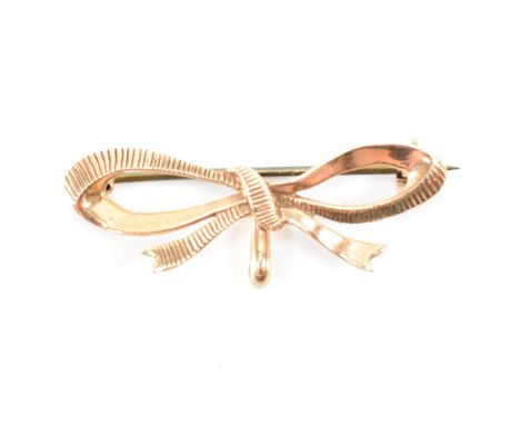 9ct gold hallmarked brooch clip / fob watch mount pendant in the form of a bow. Pin verso with hook for fob watch bale. Hallm