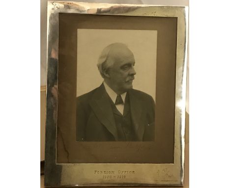 BALFOUR (Arthur James)Portrait photograph, signed in ink to the mount, in a hallmarked silver frame engraved 'Foreign Office 