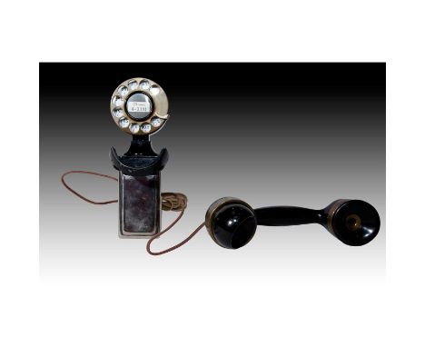 Black chrome metal rotary dial compact phone, Bakelite receiver.An antique black and chrome metal rotary dial Spacesaver comp
