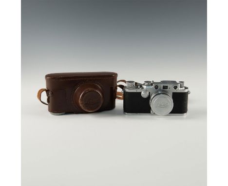 Camera, Summitar 2 50mm lens, lens cap, case, "Red dial" camera.When Ernst Leitz took a chance on his designers radical conce