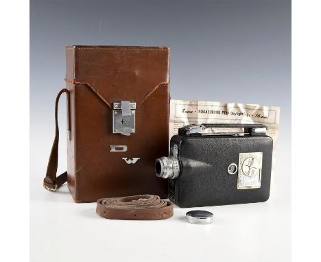 Spring-wound 16mm silent-film era camera, with case and manual.Produced by Eastman Kodak circa 1930-1960s. The black camera c