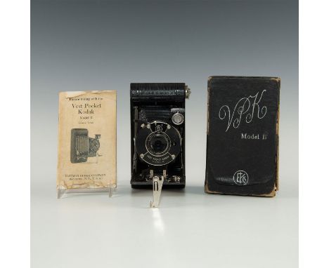 A miniature folding camera from the dawn of photography.Camera has its box that includes an original operators manual with ag
