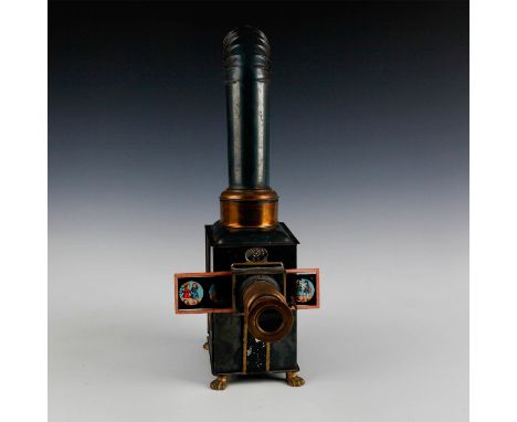 Brass and metal. Oil burner and cast metal chimney.An antique magic lantern glass slide projector, Gloria model, including fi