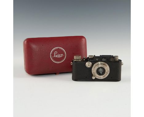 Original, black version of iconic German camera in red clamshell.When Ernst Leitz took a chance on his designers radical conc