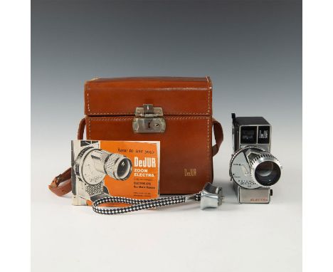 Case, stap/handle, manual- clever zoom keys and classic look. Issued: 20th c. Dimensions: 8"L x 5.5"D x 7.5"H, in case Manufa