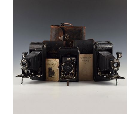 2C Pocket; 2C and 3 Model A- chrome, black, with cases.Splendid array of antique Kodak large format roll film cameras. The 2C