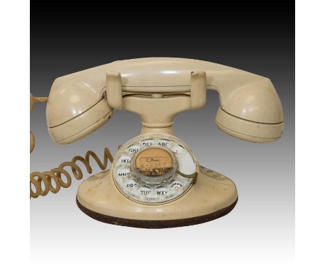 Tan rotary body, Bakelite handset. Original label with #CA6-6962. Issued: c. 1955 Dimensions: 5.25"H Country of Origin: Unite