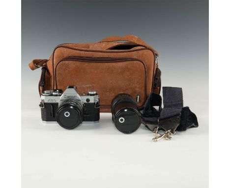 Legendary Olympic camera in shooting-shape, 1.8 F50mm attached.The Canon AE-1 was one of Canon's most popular cameras- ever. 