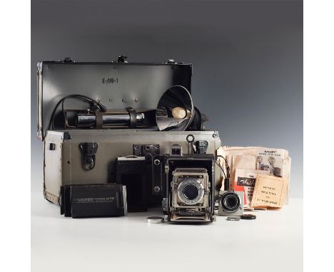 Speed Graphic camera, flash system, extra shutter, film holders.Graflex was synonymous with large format, highly capable, and