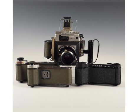 Large, vintage- with working shutter and 4 replaceable film backs.Mamiya medium and large format press cameras could be found