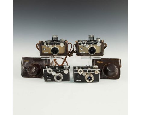 Four retro art deco styled American 35mm cameras in black, cream.Group of 4 vintage C3 Argus cameras including two black stan