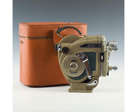 Running cine camera with lens in hard case. Handle included. Issued: 1960s Dimensions: 10"L x 5.25"D x 9.75"H, in case Manufa