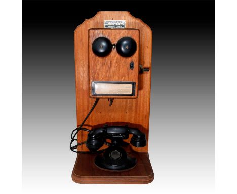 Bakelite handset, spit cup mouthpiece. Large wooden ringer box.A Western Electric Model 202 desk set and ringer box, manufact