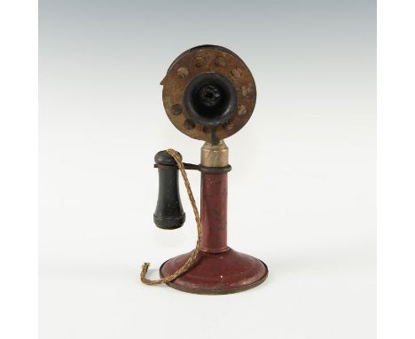 Red metal stand, shaft. Working toy rotary dialer. Issued: c. 1930 Dimensions: 7.75"H Country of Origin: United States  Condi