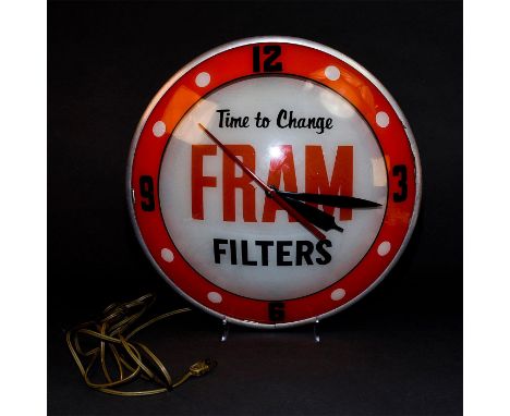 Large wall clock, two light sockets within, Fram Oil filters ad glass.ï¿½Lighting sockets tested, working. Motor and time mec
